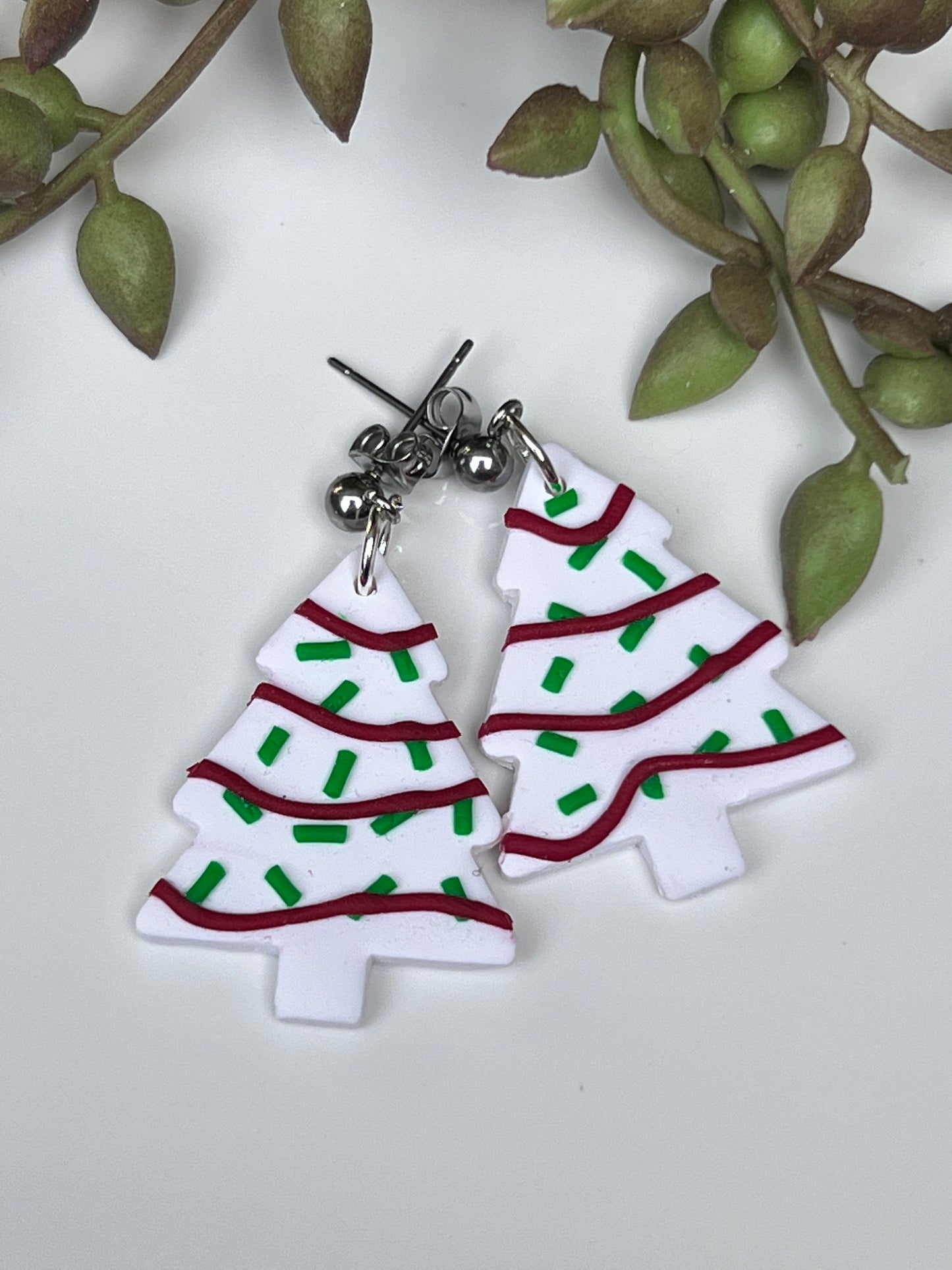 White Christmas Tree Cake earrings with red garland, green sprinkles for winter made from polymer clay and stainless steel