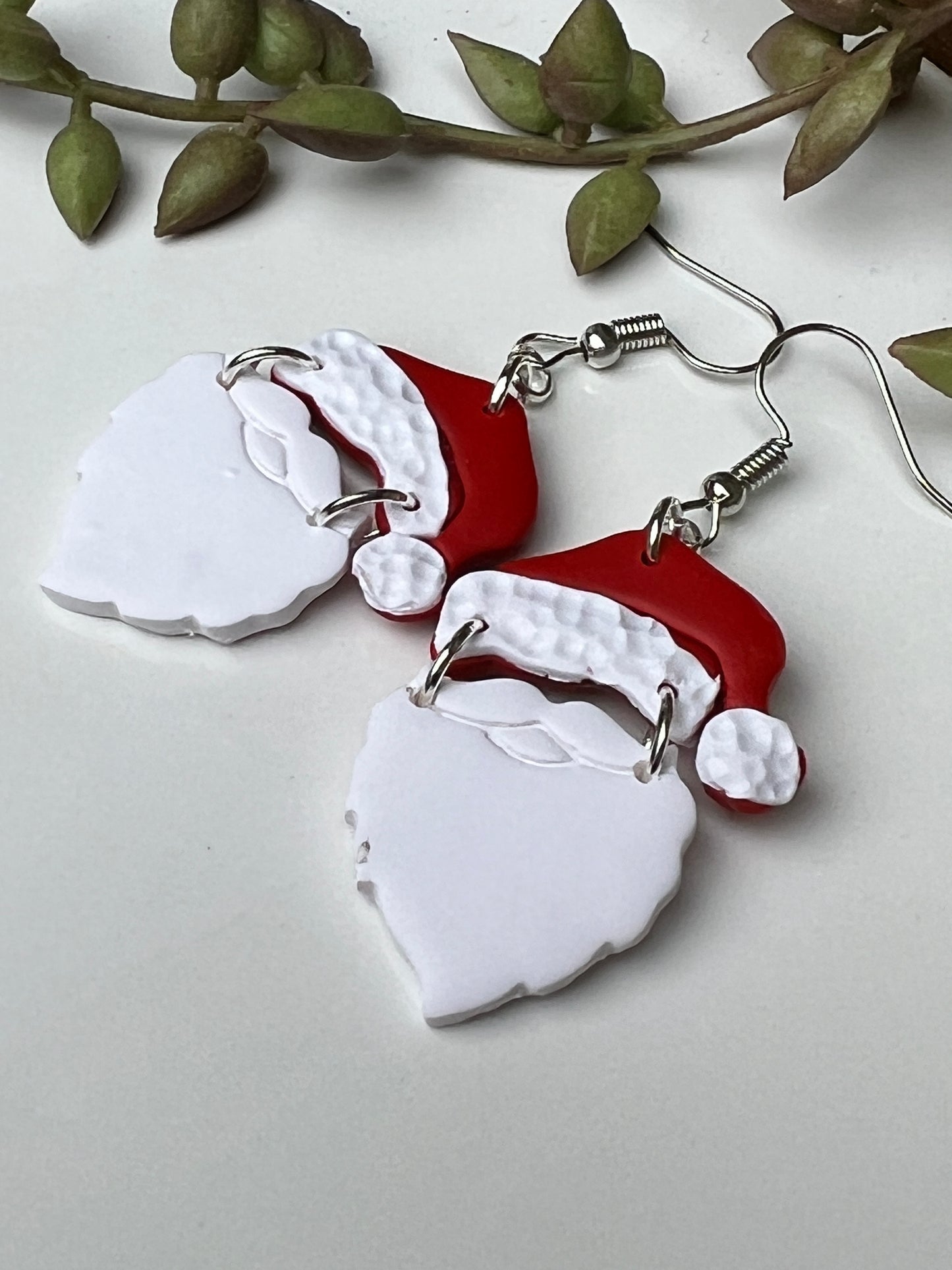 Ho! Ho! Ho! Take your Christmas spirit with you everywhere you go with these handcrafted dangles featuring the jolly one himself, the one and only Santa Claus!  Crafted with lightweight and durable polymer clay and hypoallergenic stainless steel findings.