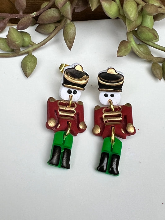 March into the holidays with these hand-painted Christmas Toy Soldier dangle earrings.  Crafted with lightweight and durable polymer clay and hypoallergenic stainless steel findings.